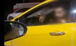Taksici, içinde müşteri olan meslektaşının aracının önünü kesip, tehdit etti